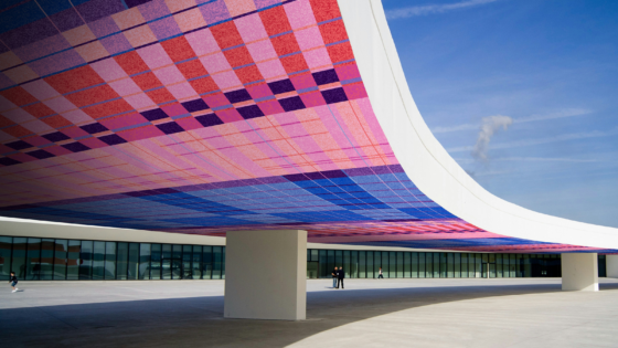 render of arched architectural structure with modieus carpet pattern on surface