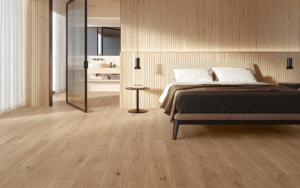 minimalist bedroom set with surfaces in LOG wood effect tiles from Atlas Concorde