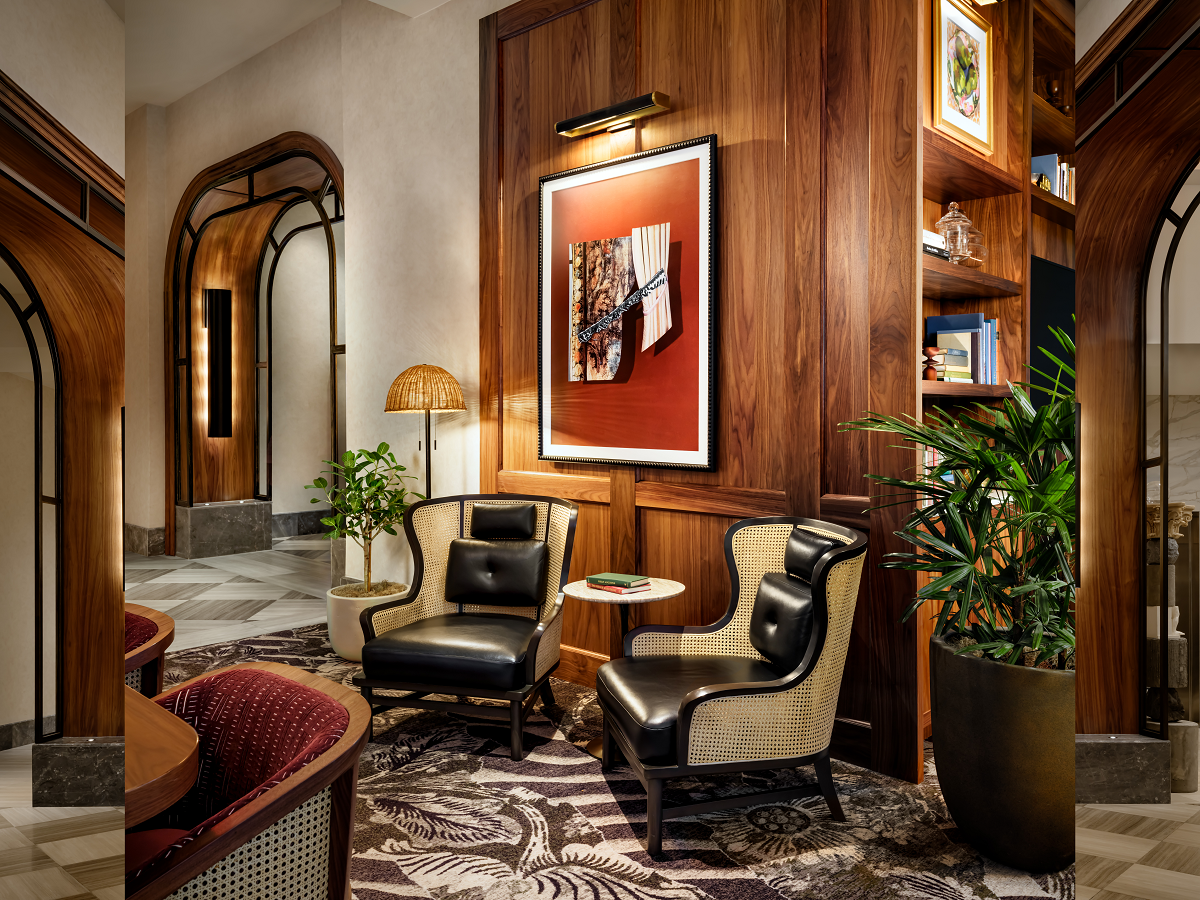 wood panelling and seating with art on the walls in the lobby Sofitel Philadelphia