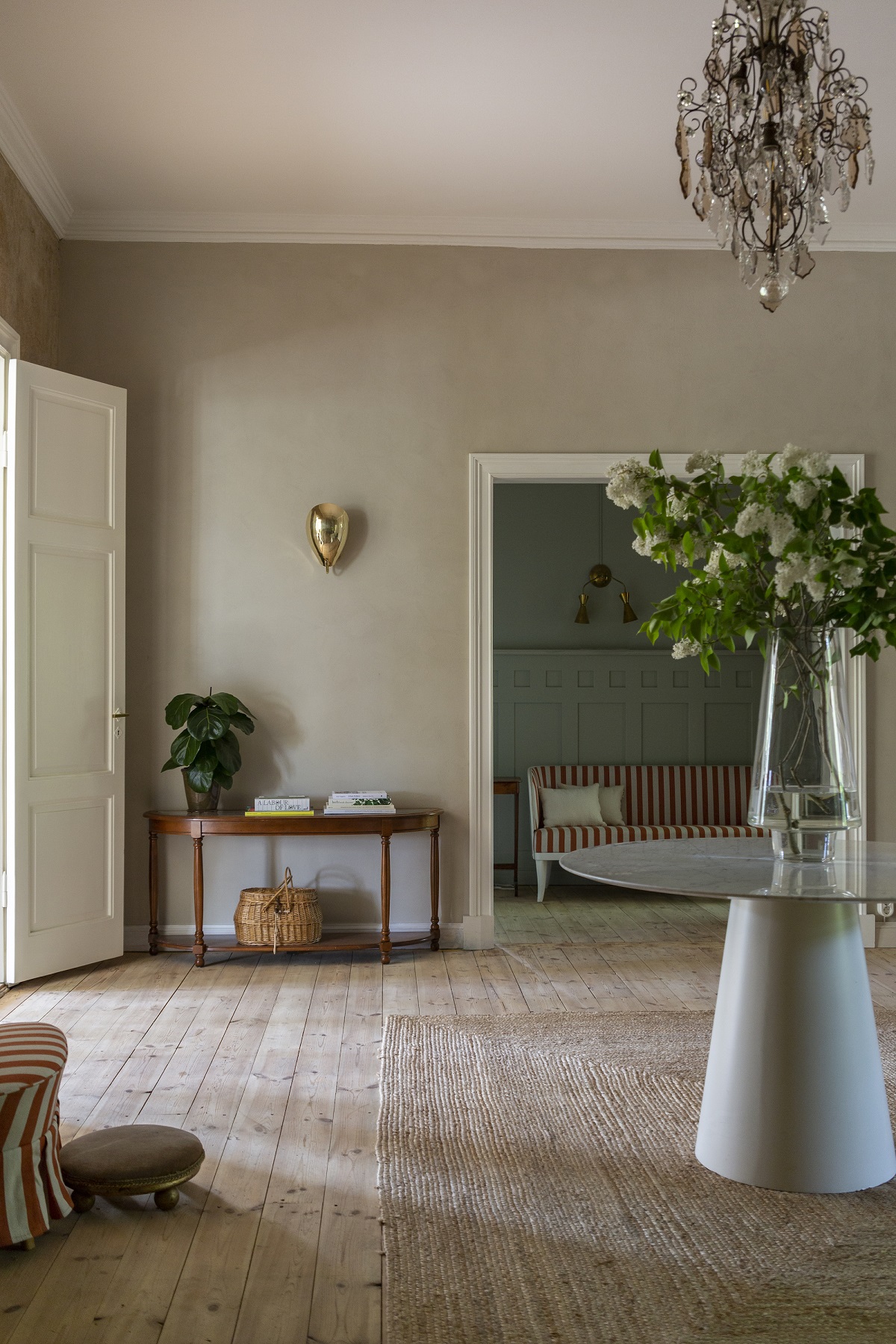 wooden floor, natural matting and flowers in hallway