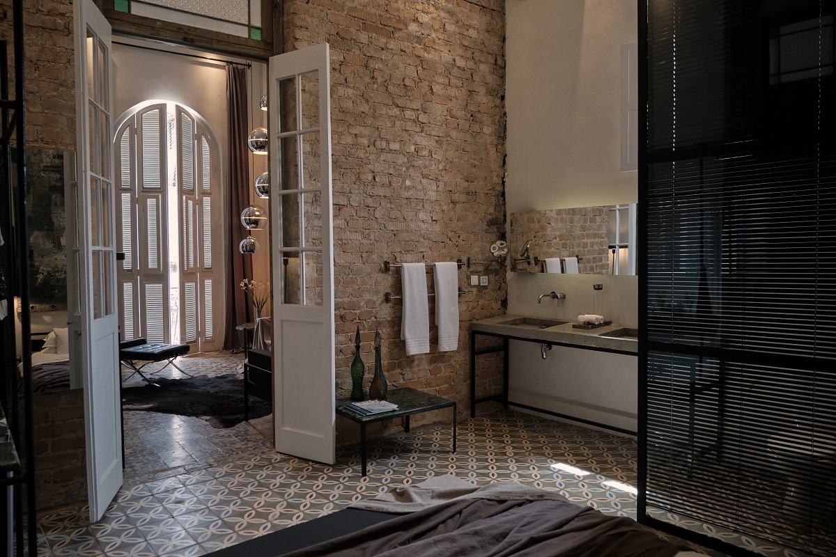 view from bed into bathroom and salon in AS Boutique Residence