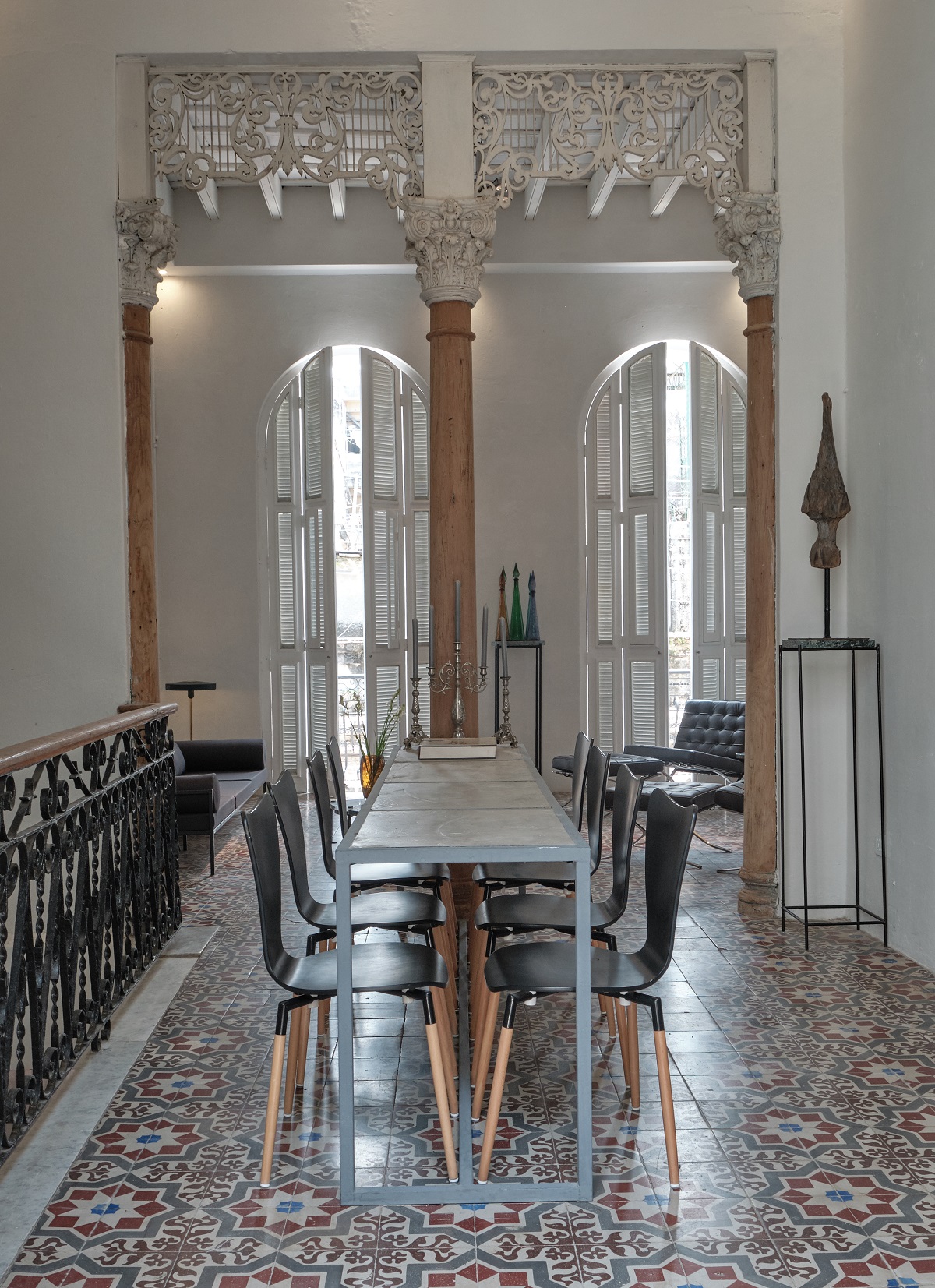 cafe and dining area with tiled floor and windows with shutters