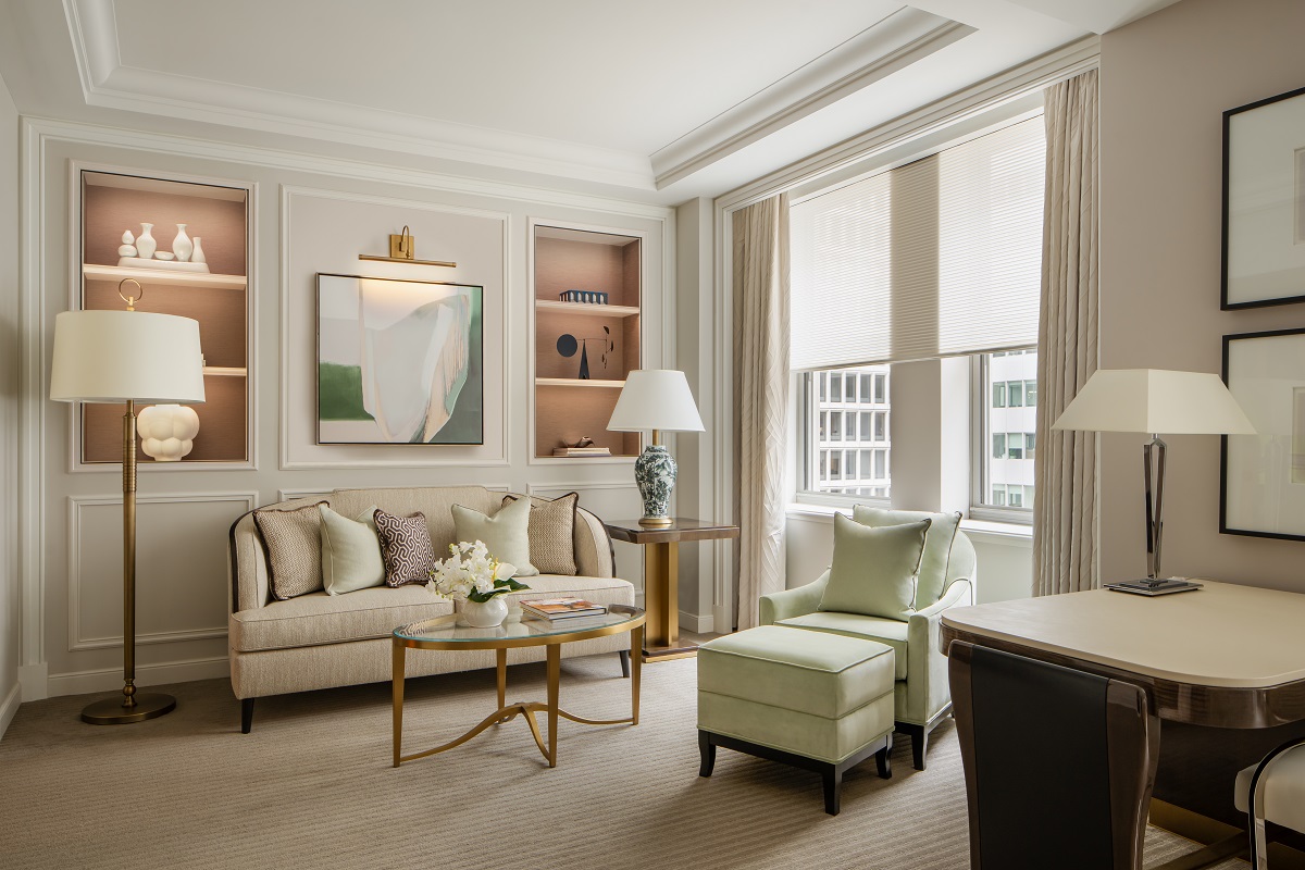 couch , armchair and art in guest suite in Waldorf Astoria New York