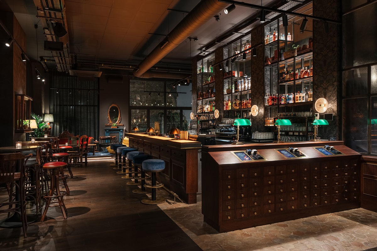 dark walls and wood interior design in the bar at Ruby Stella