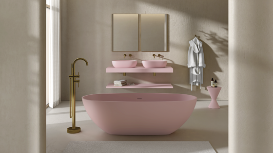 pink freestanding bath and basin with brass fittings in cream bathroom room set