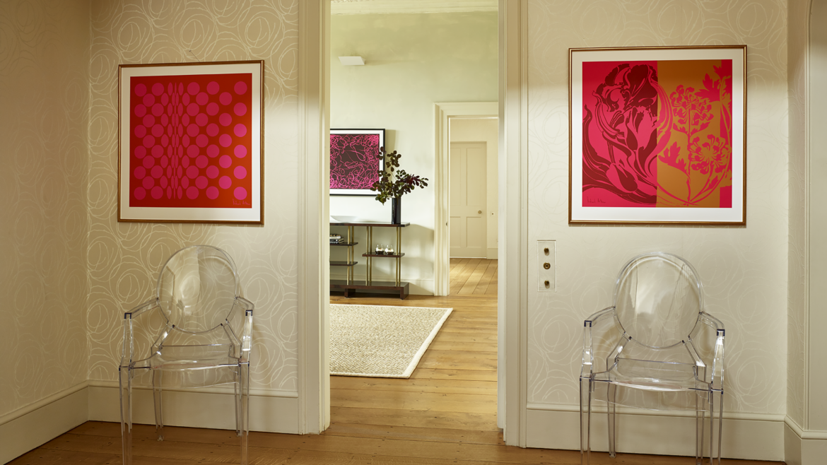 framed Richard Allan scarf prints on either side of door