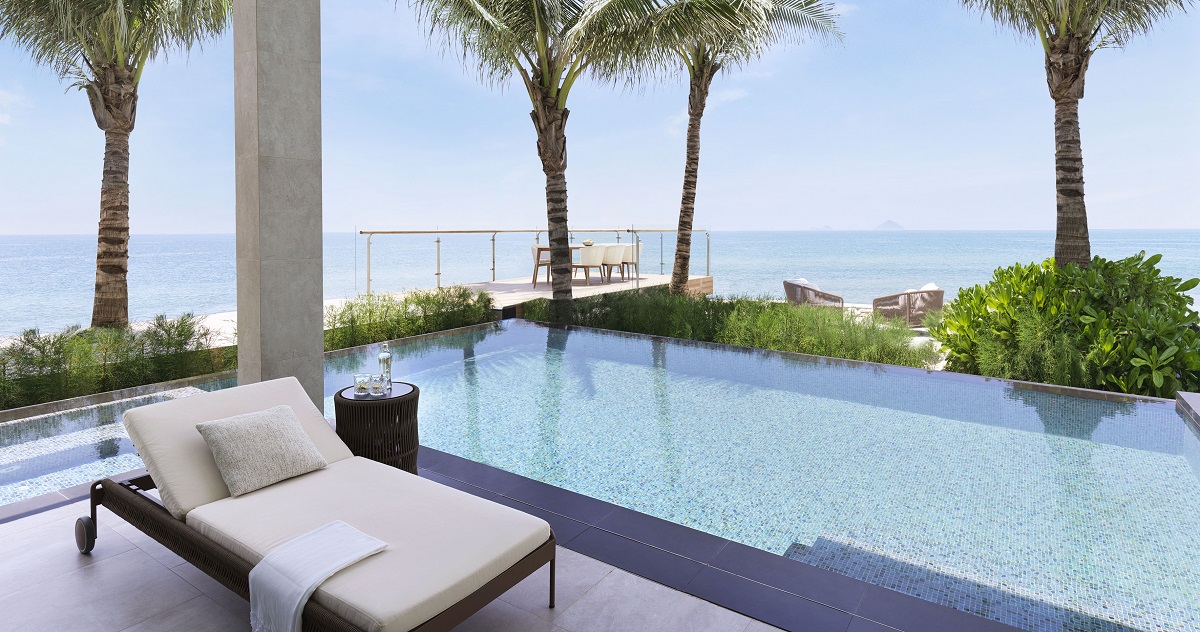 sunlounger alongside infinity pool at ocean front villa