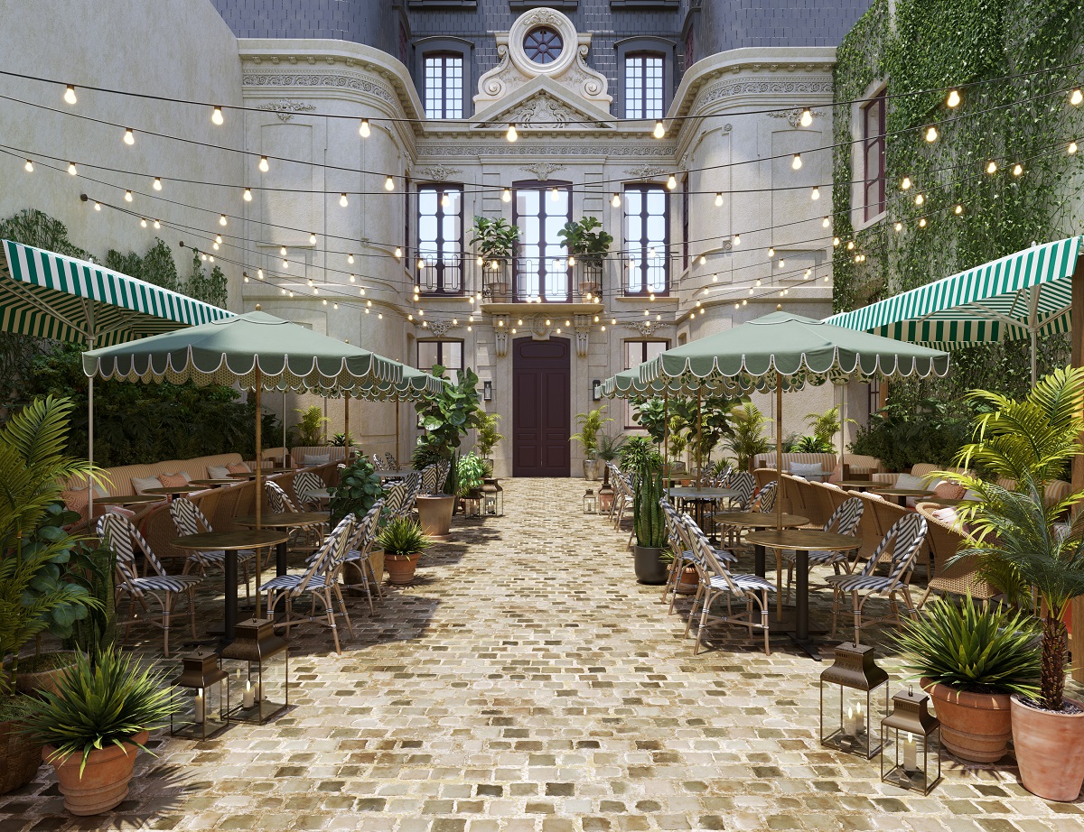 striped parasols and fairylights in the courtyard of Le Jardin de Verre Paris by Locke