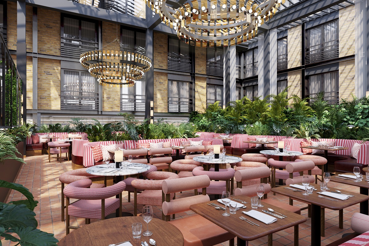 red striped furniture, exposed beams and statement chandelier in the hotel atrium 