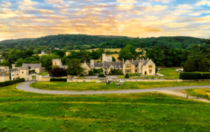 aerial view of ellenborough Park hotel and surrounding countryside with early morning sky