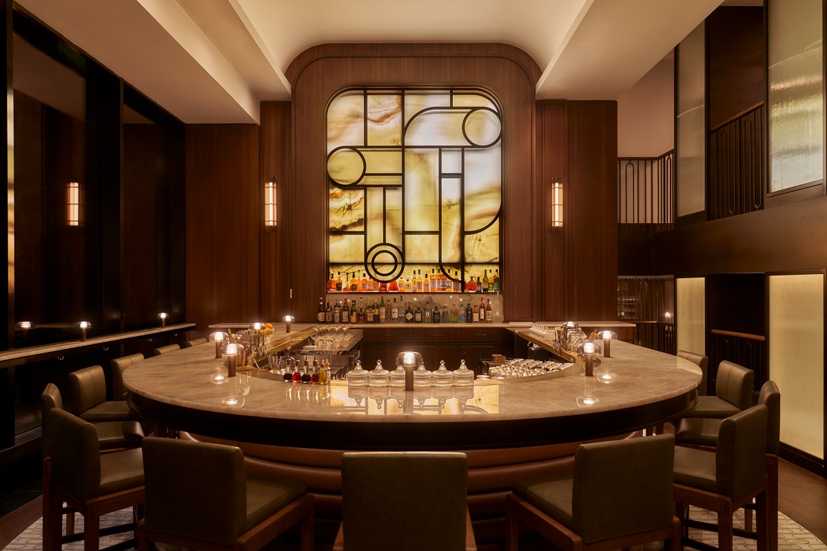 curved central bar with stain glass window behind in Santi Manhattan 