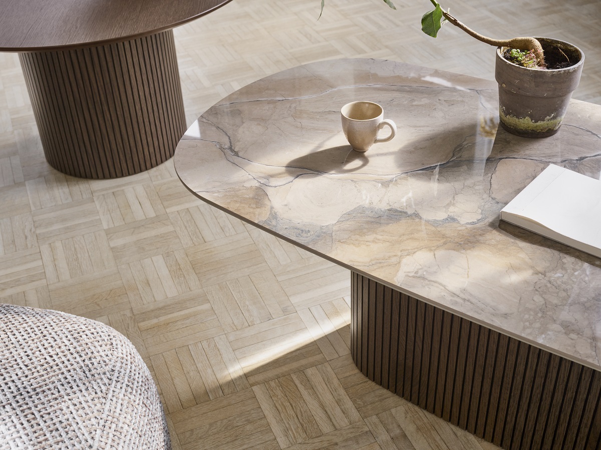 wooden floor, ceramic coffee table surface with mug and pot plant