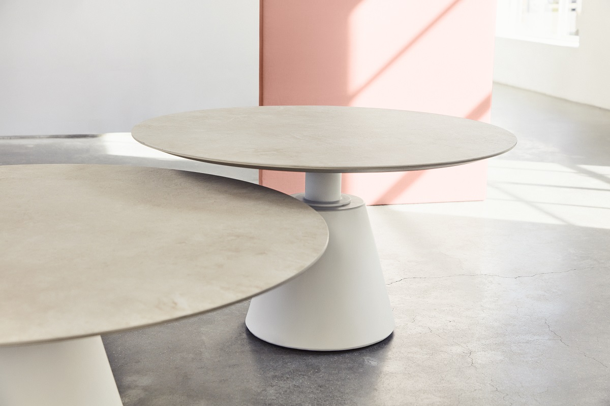 round table with ceramic tabletop on cylindrical central base