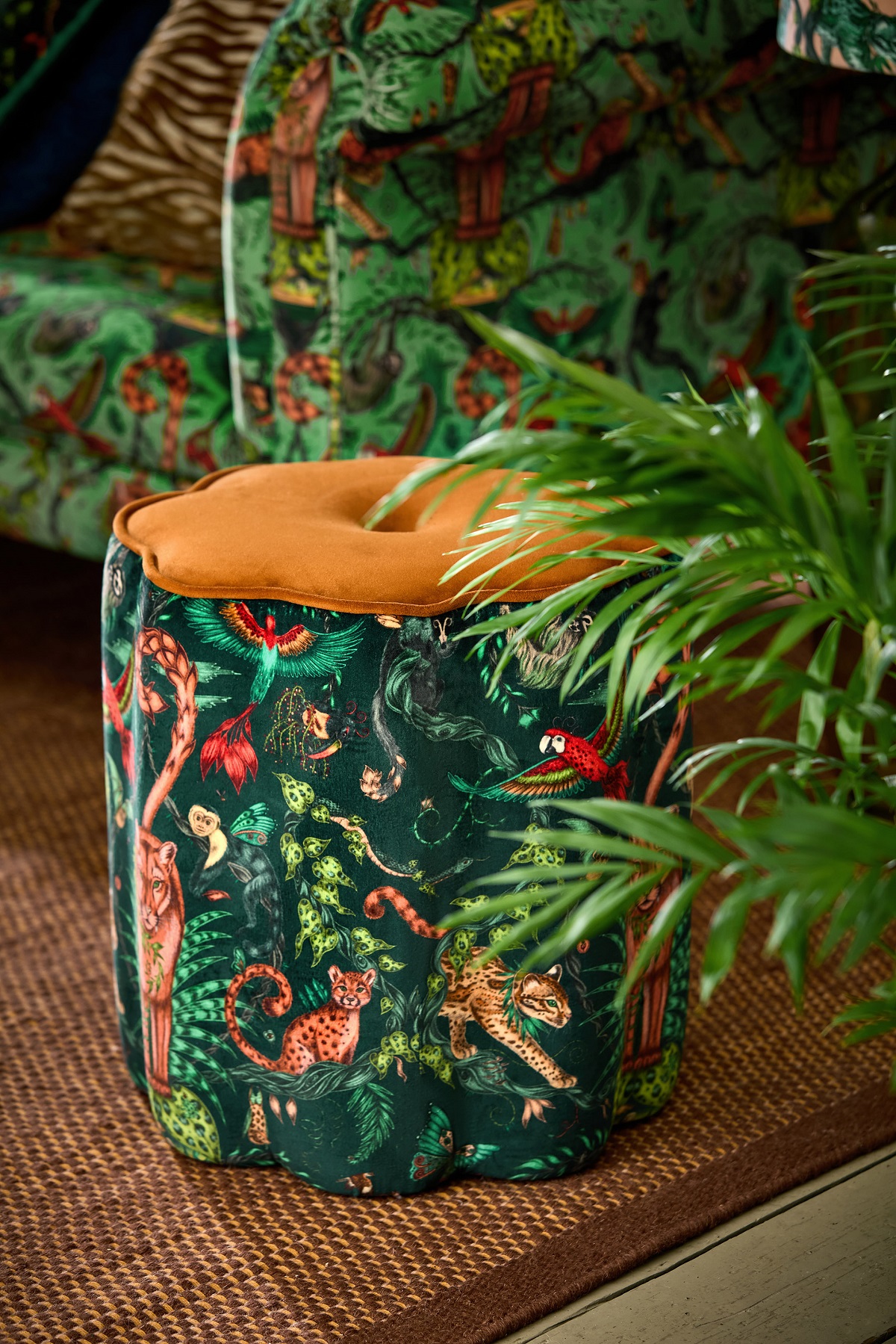 footstool covered in jungle inspired Mythica Bosque Dreams fabric