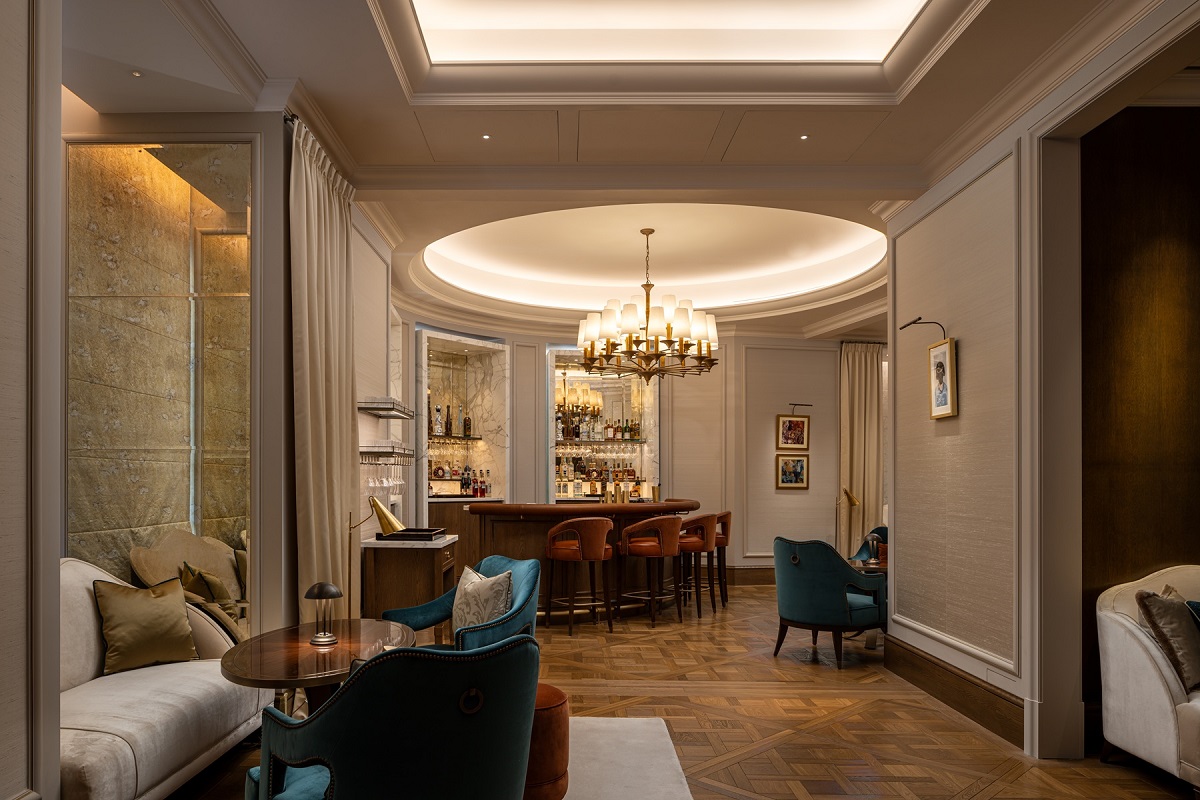 circular ceiling and chandelier above the bar