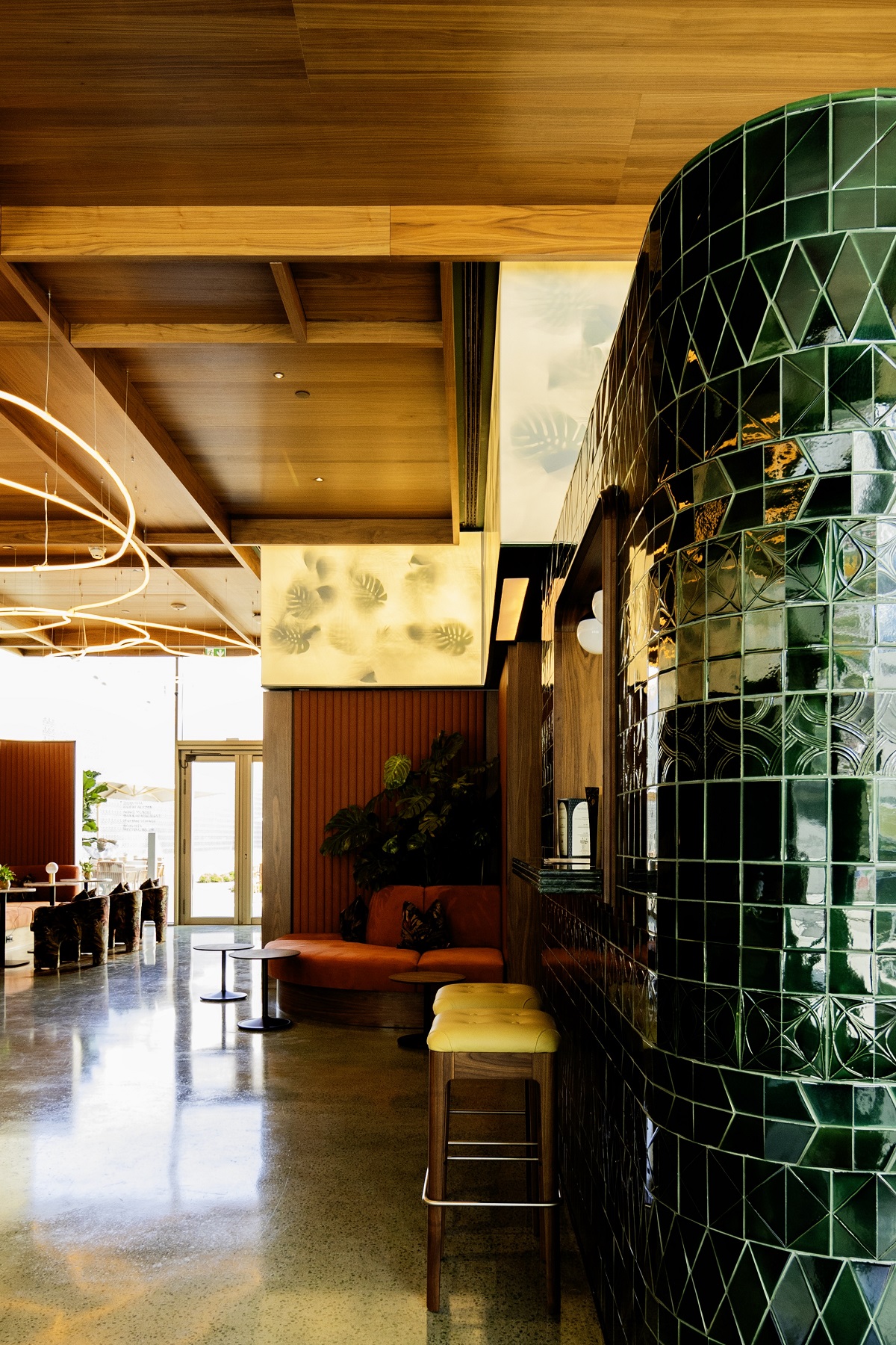 Hotel Duo Boa Vista Lisbon entrance lounge with green tiled surfaces mid century seating