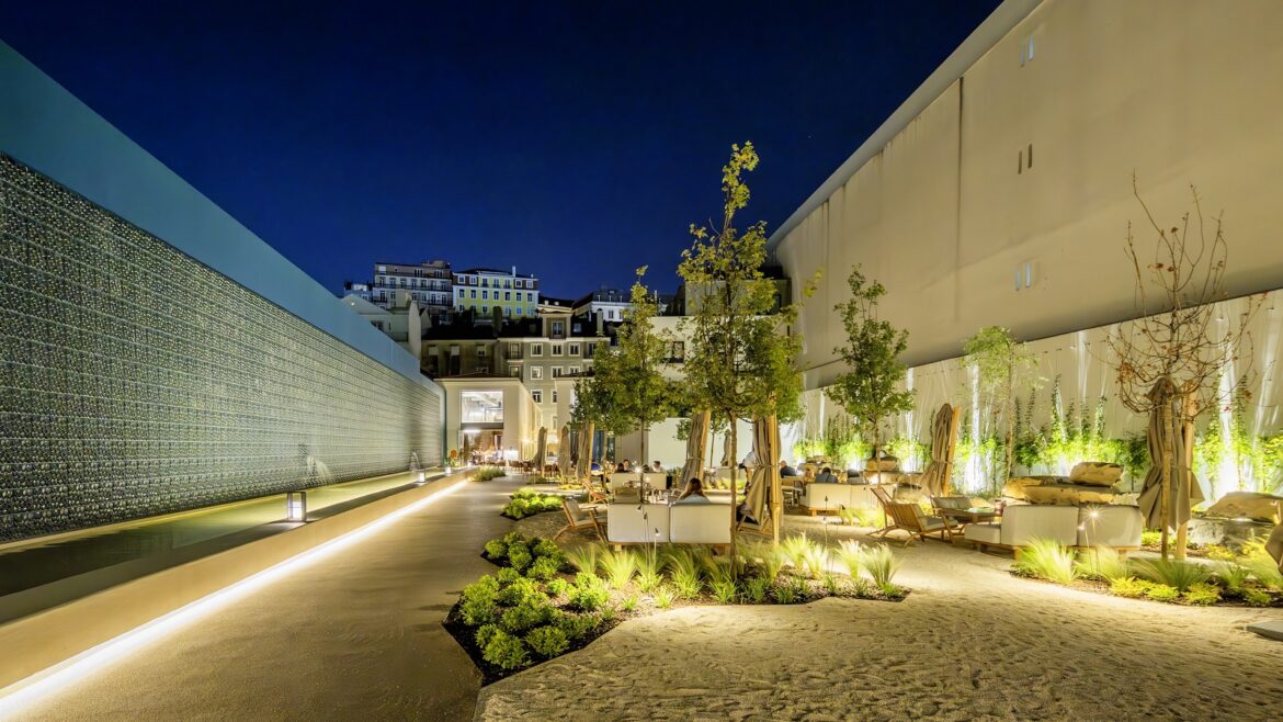 outdoor lighting, planting and seating between the two buildings of Hotel DUO Boavista