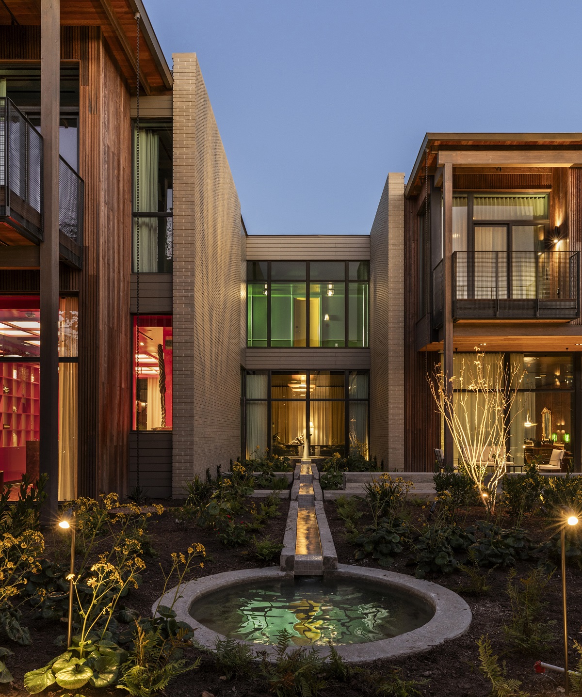 evening light and exterior of Hotel Saint Augustine with courtyard and water feature