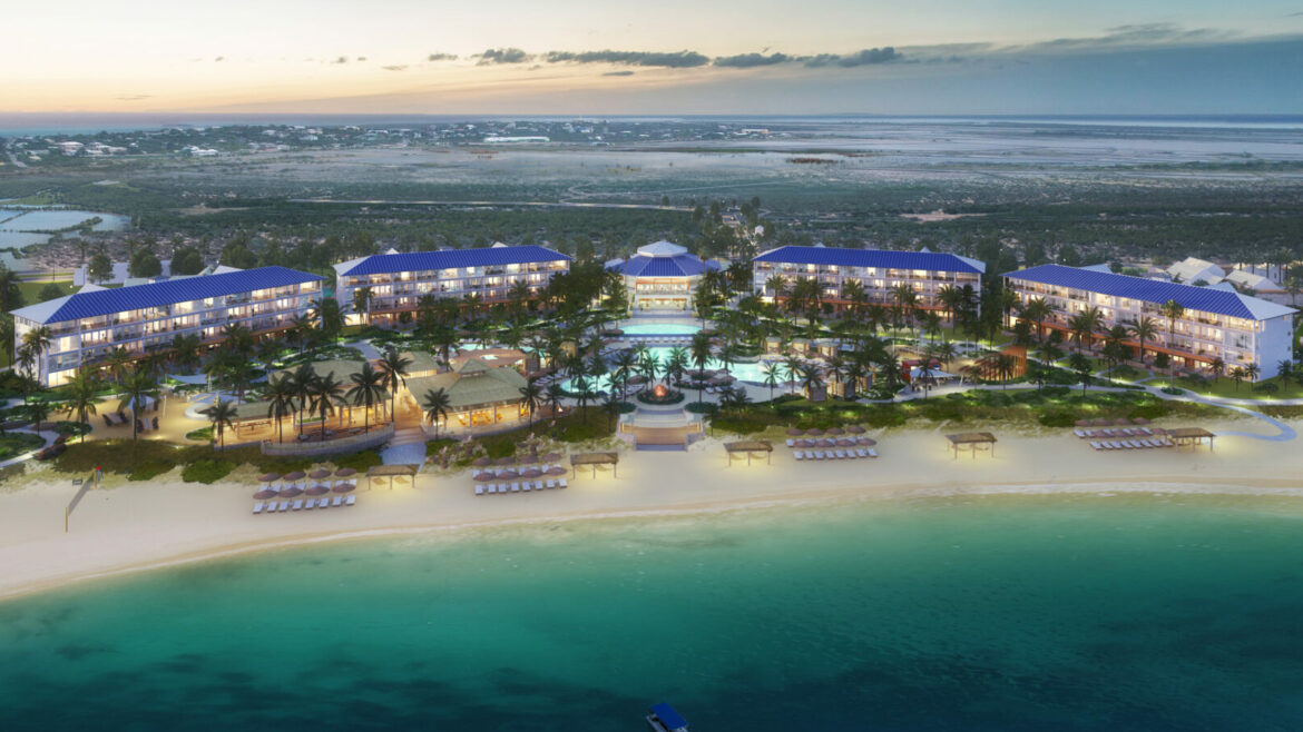 Aerial shot of the blue waters and white sand beaches in front of the Salterra beachside resort