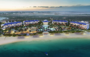 Aerial shot of the blue waters and white sand beaches in front of the Salterra beachside resort