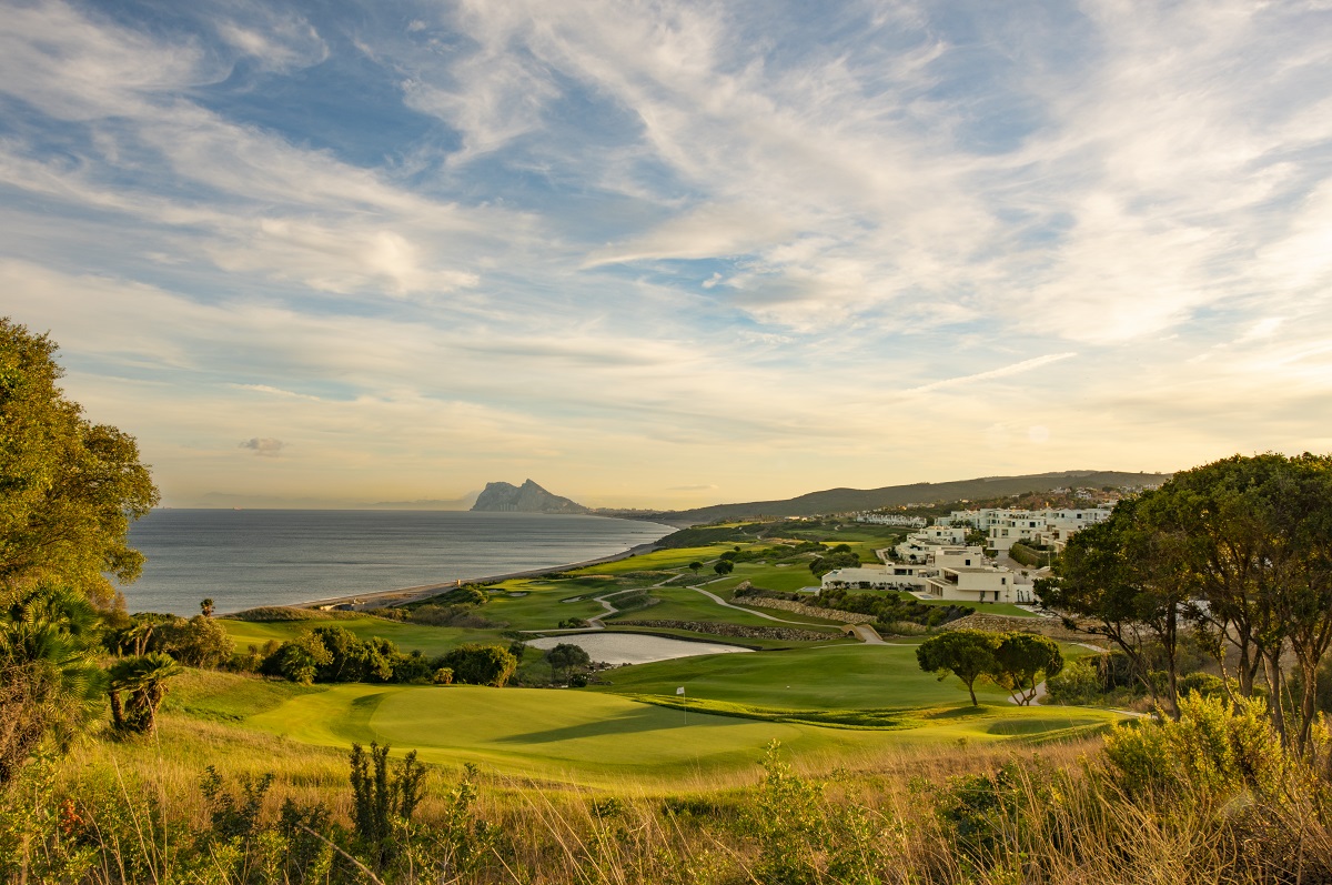 views of sea and mountains across the golf course at Fairmont La Hacienda