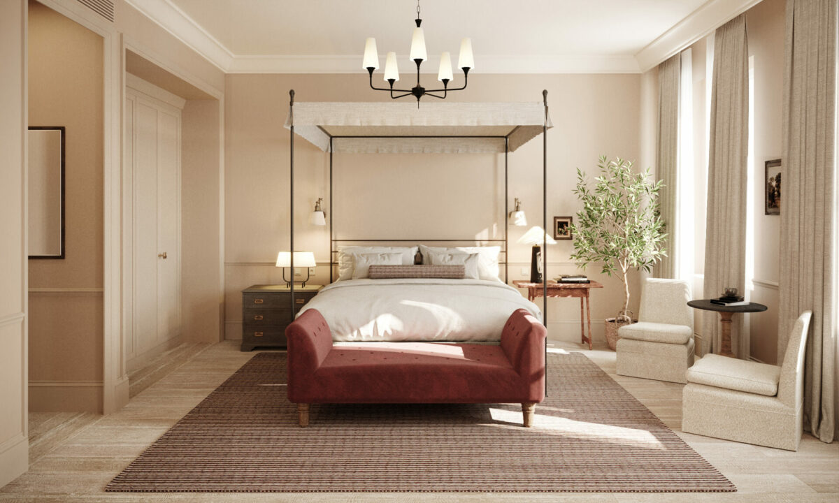 Templeton Garden suite: elegant four poster bed sits centrally with rust coloured sofa at the base. Windows to the right. 