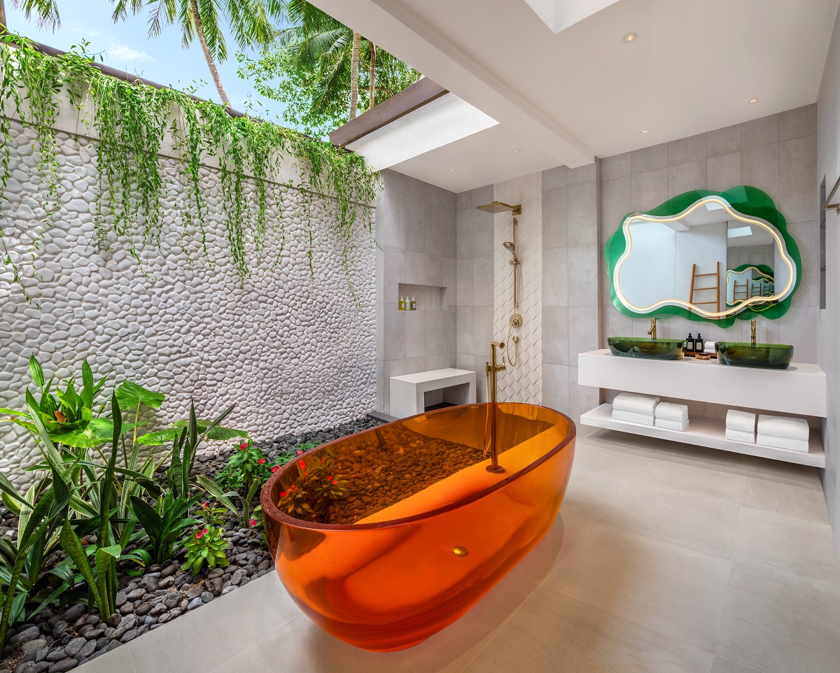 outdoor bathroom with orange bath and plants W Maldives