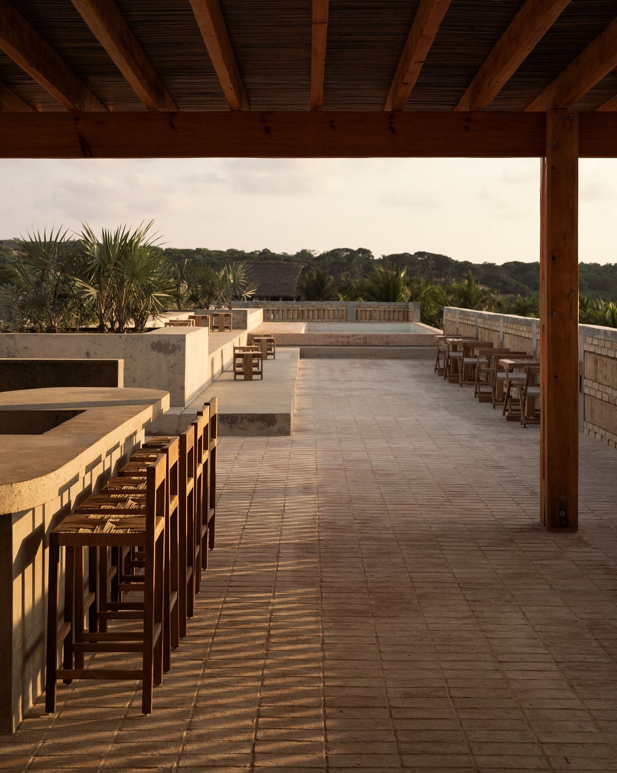 concrete surfaces on the rooftop of Hotel Humano leading to pool