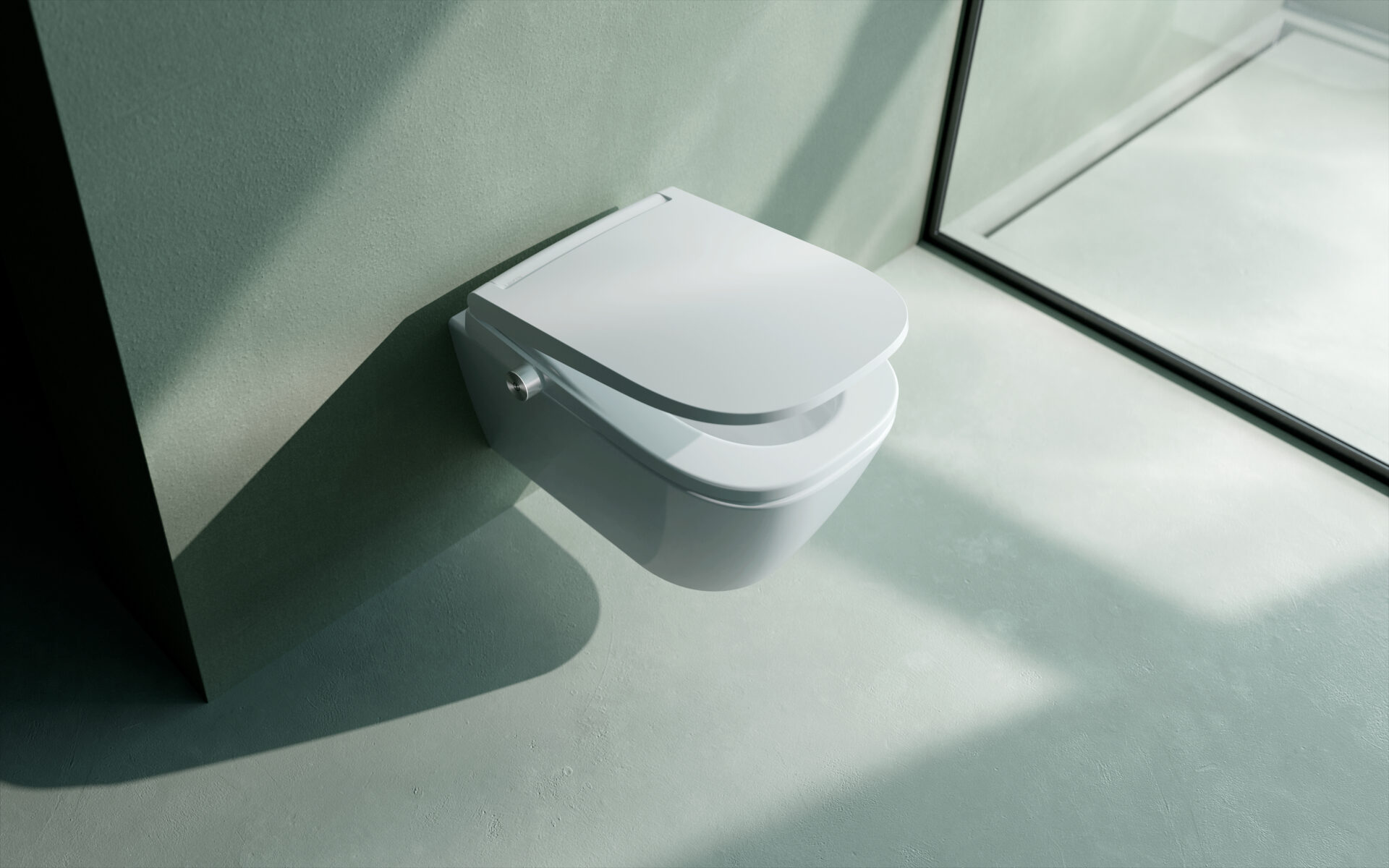 White floating toilet with half raised lid, in a stripped back pale green bathroom