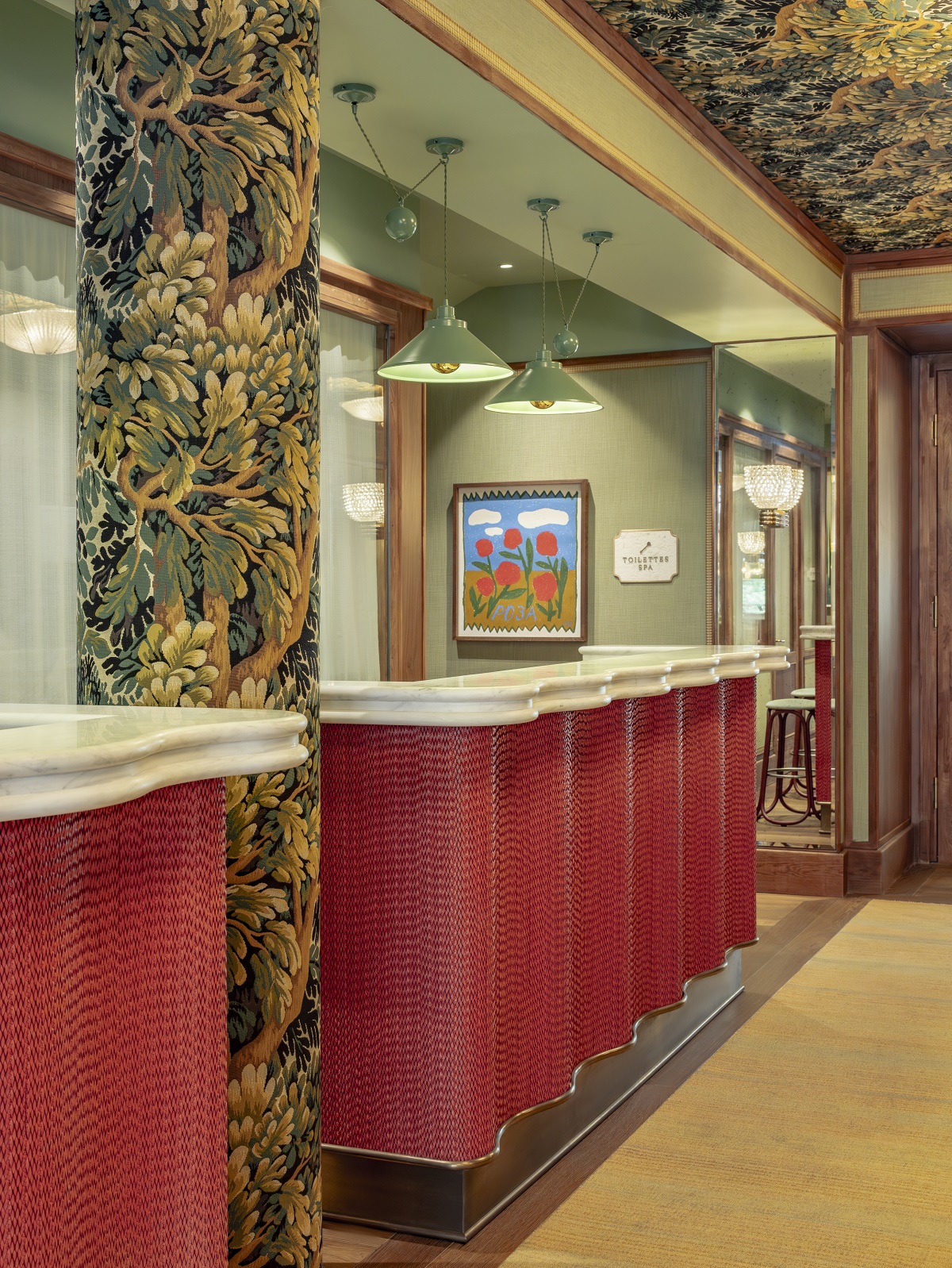 red reception desk and floral wallpaper wall and ceiling