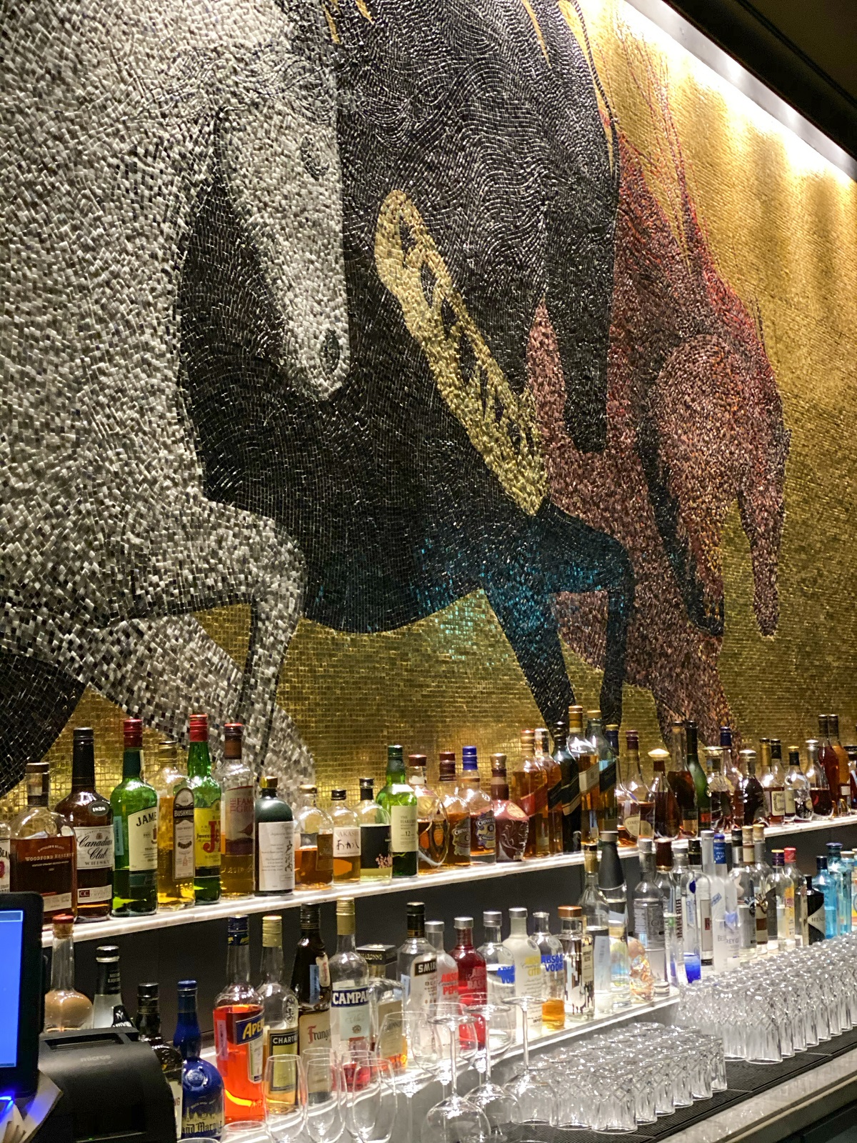 detail of mosaic behind bar