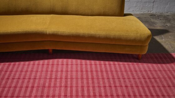 mustard sofa on red Modieus carpet