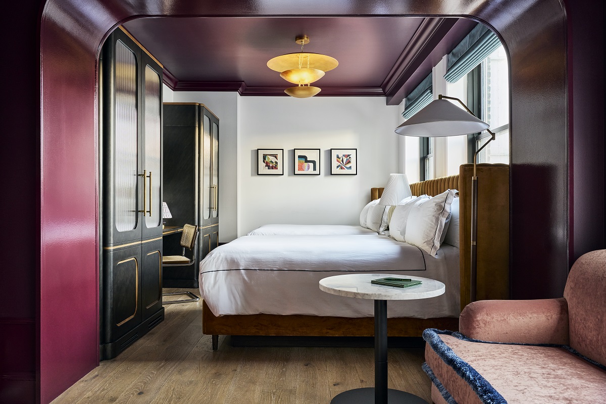 guestroom with dark purple ceiling, aubergine details and pale grey walls