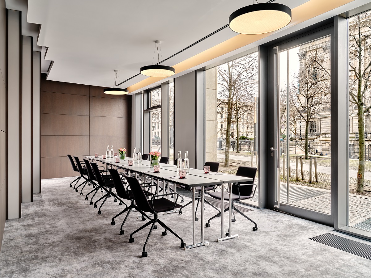 grey carpet and walls and floor to ceiling window in meeting room Radisson Berlin