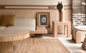 round wooden table, low wooden seating and natural fibre flooring in Élysée Montmartre Hotel