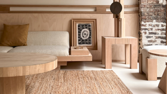 round wooden table, low wooden seating and natural fibre flooring in Élysée Montmartre Hotel