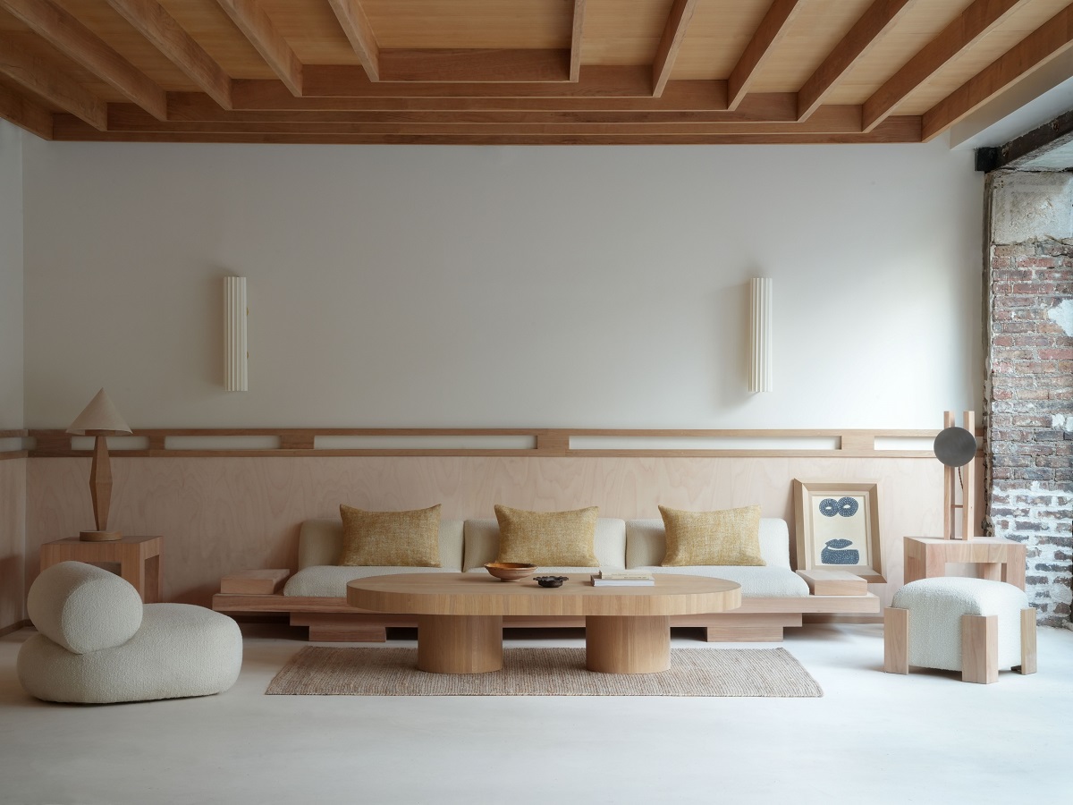 pale wood and low bench seating in public area of the Élysée Montmartre Hotel