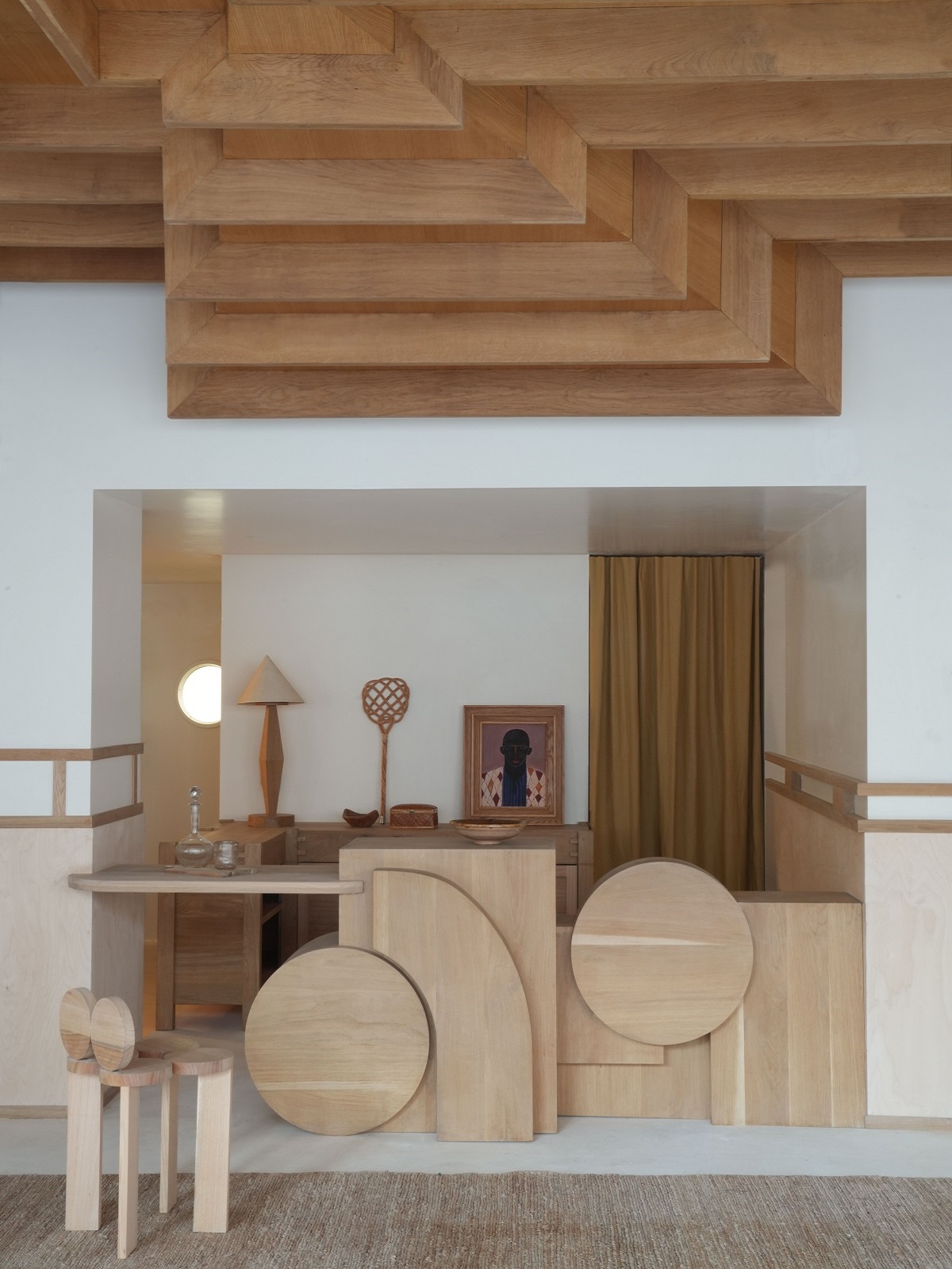 minimalist coffered wooden ceiling with organic natural wood shapes and furniture