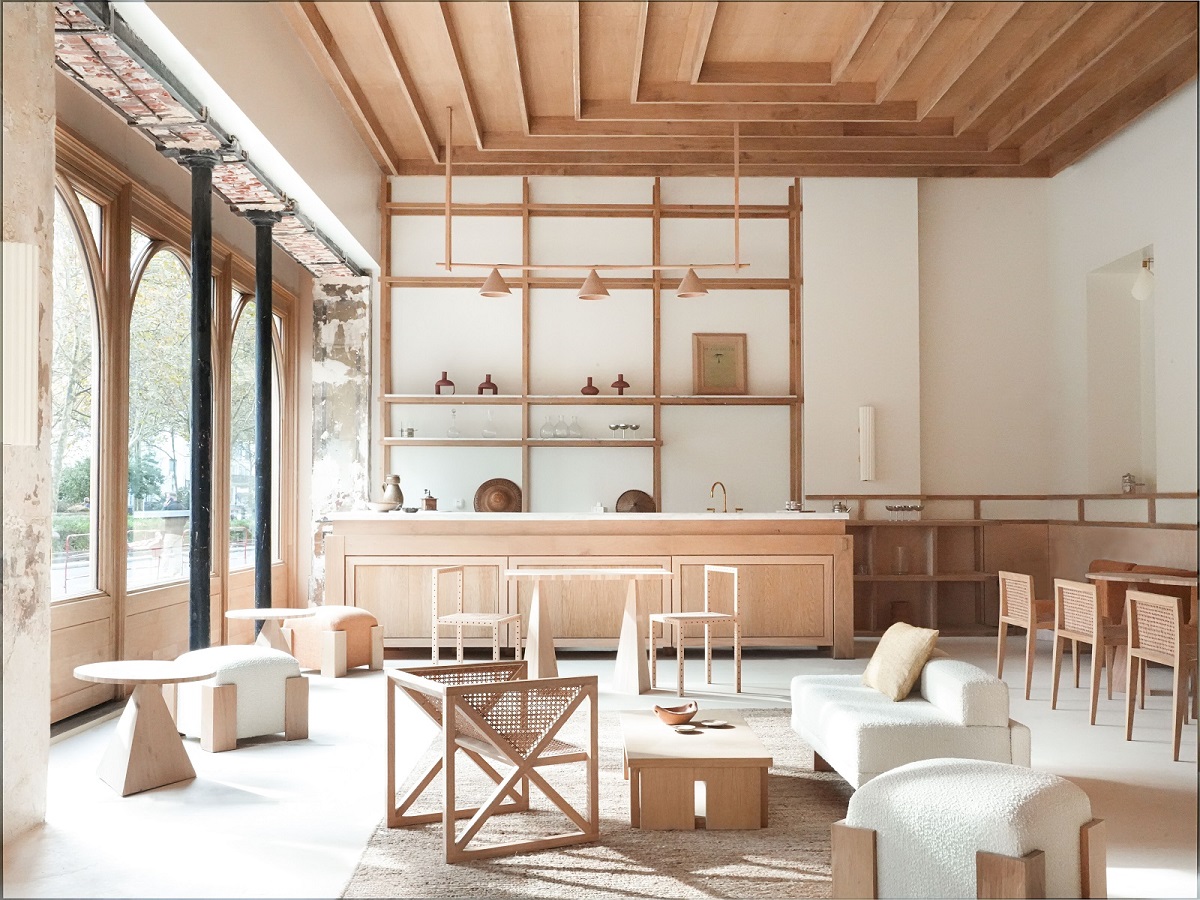 natural light through floor to ceiling windows on natural wood furniture and surfaces in the Élysée Montmartre Hotel