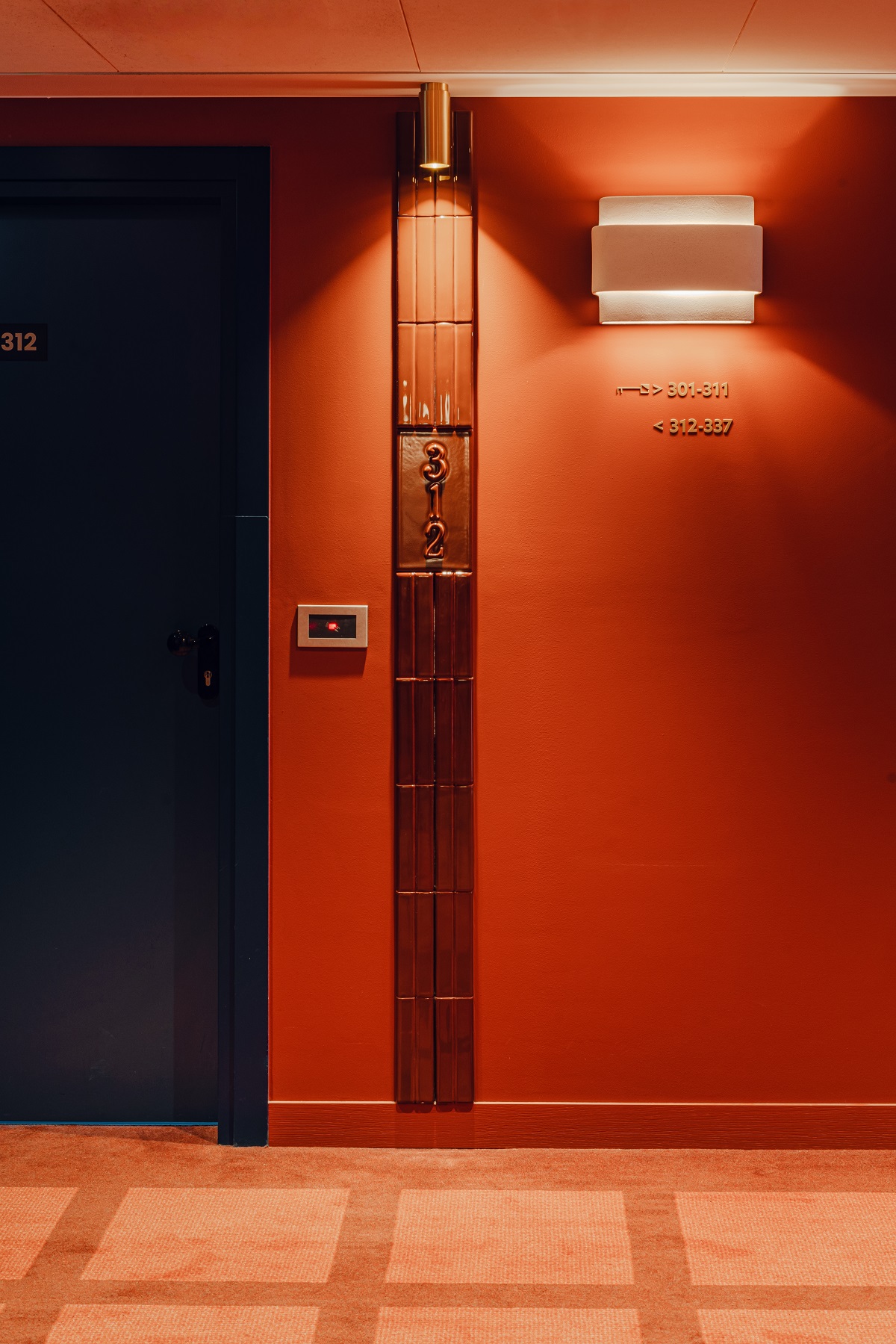 dark rust colour drenched corridor in Puro with tiled detail