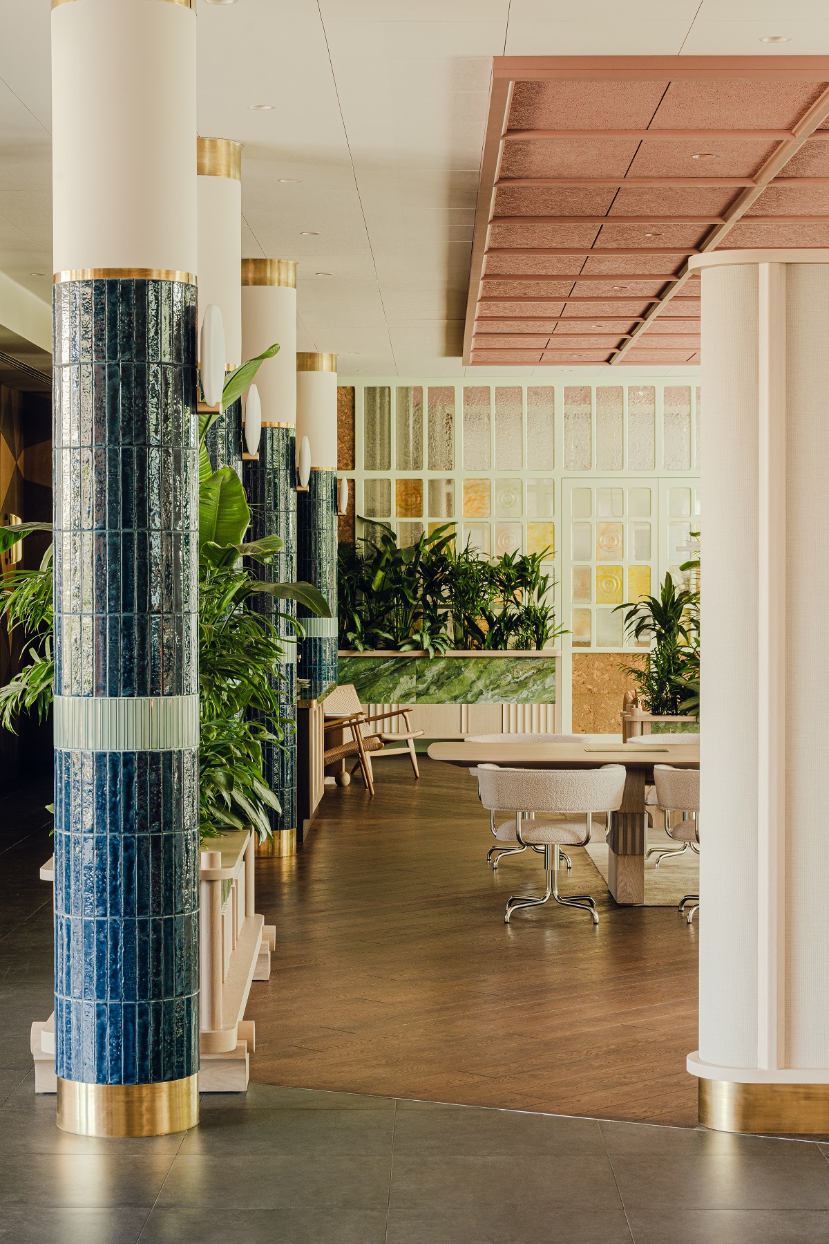 tiled pillars leading the eye into co-working area of the hotel