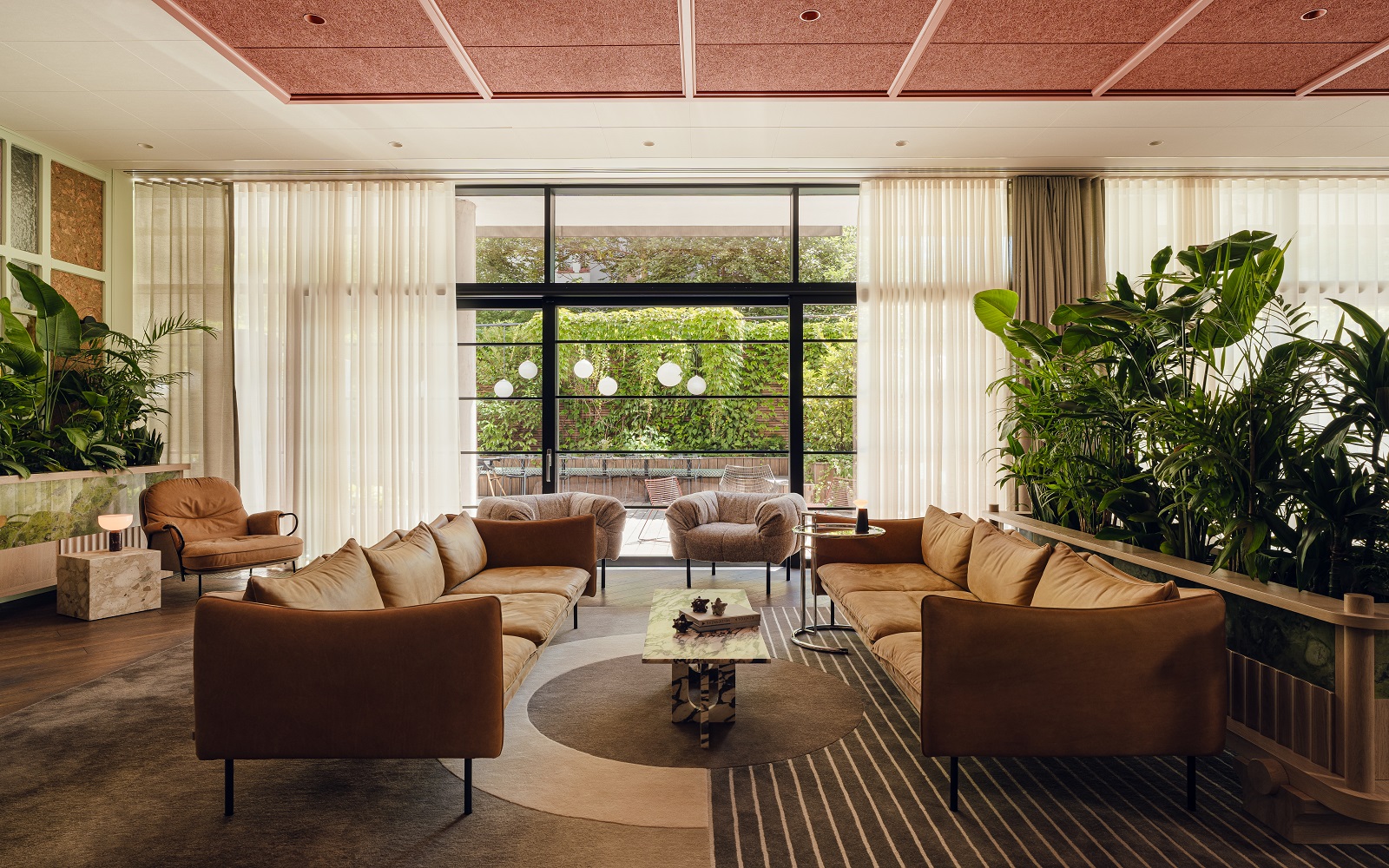 lounge seating, leather sofa, patterned rug in PURO Poznan