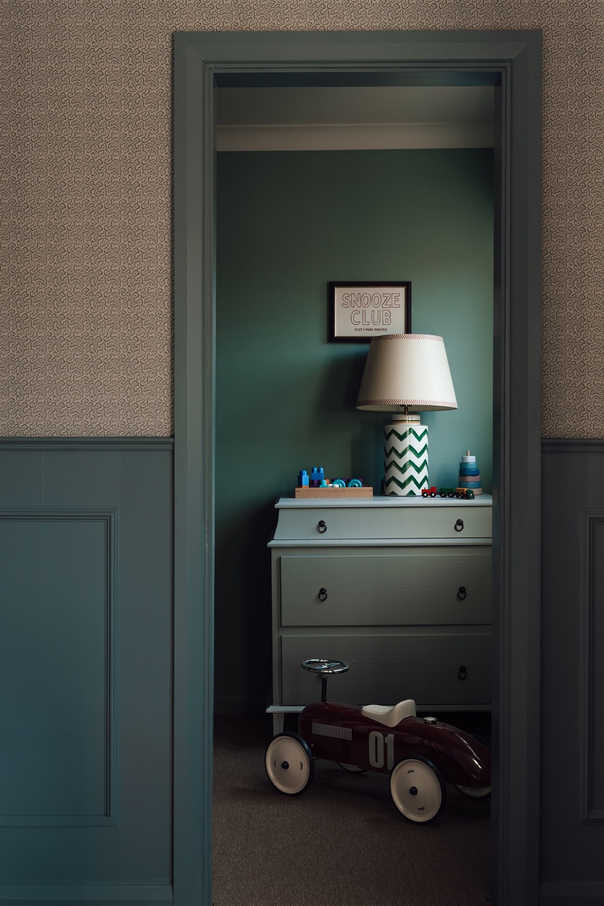view into guestroom through green door