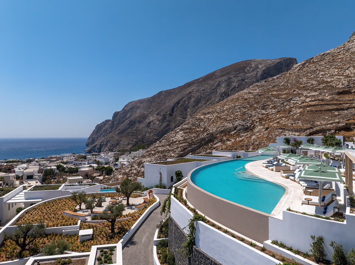 Built into the foothills of the scorched Thira mountain, Sandblu resort cascades down the mountain