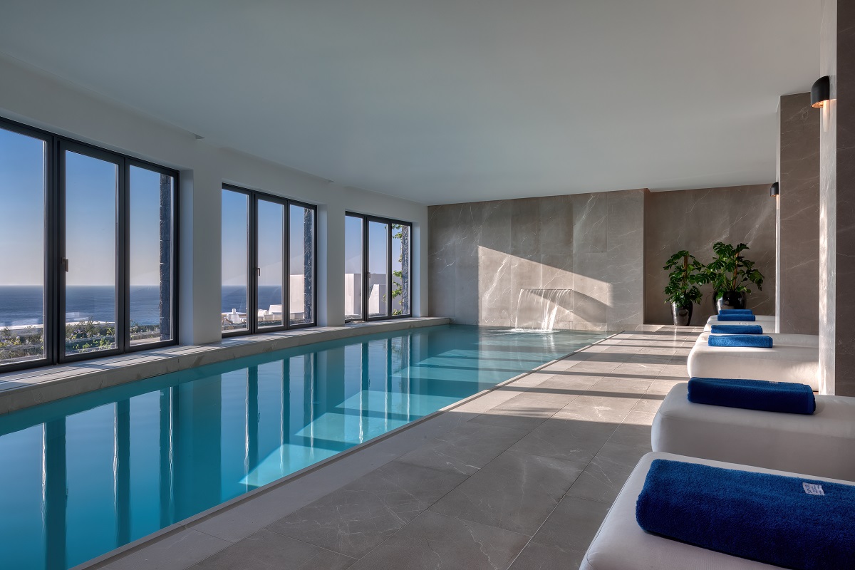 indoor pool and spa at Sandblu Santorini