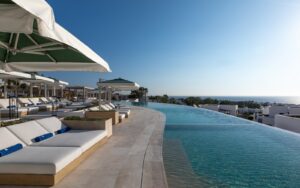 sunloungers and infinity pool at Sandblu resort Santorini