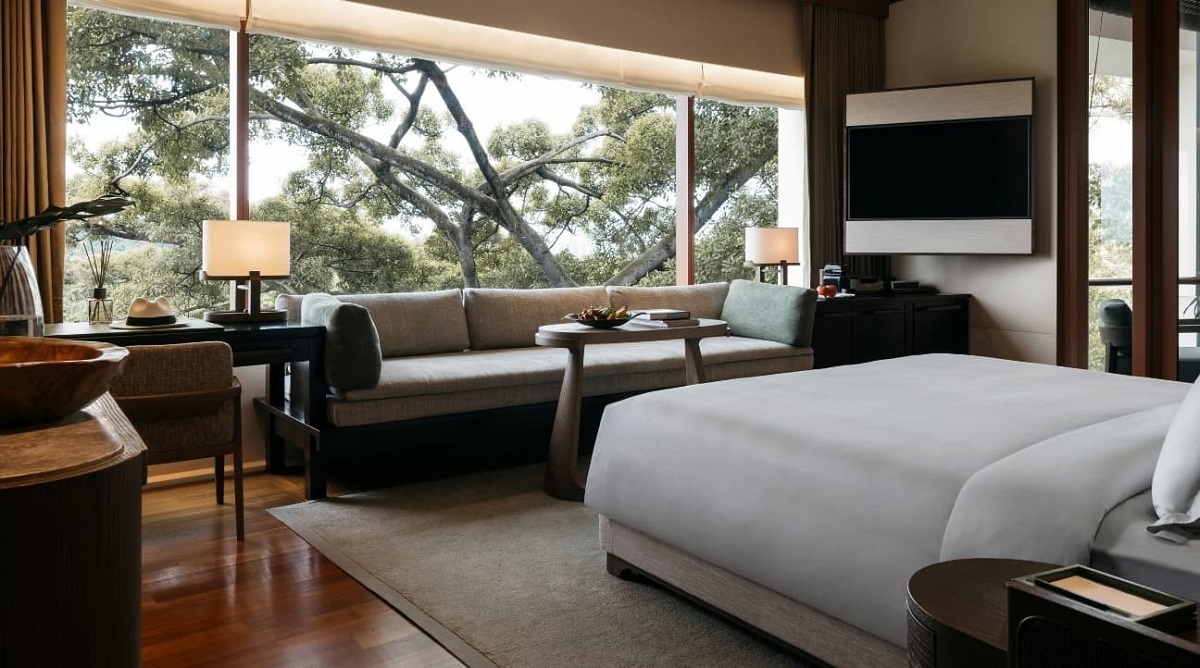 guestroom with view over trees in Capella singapore