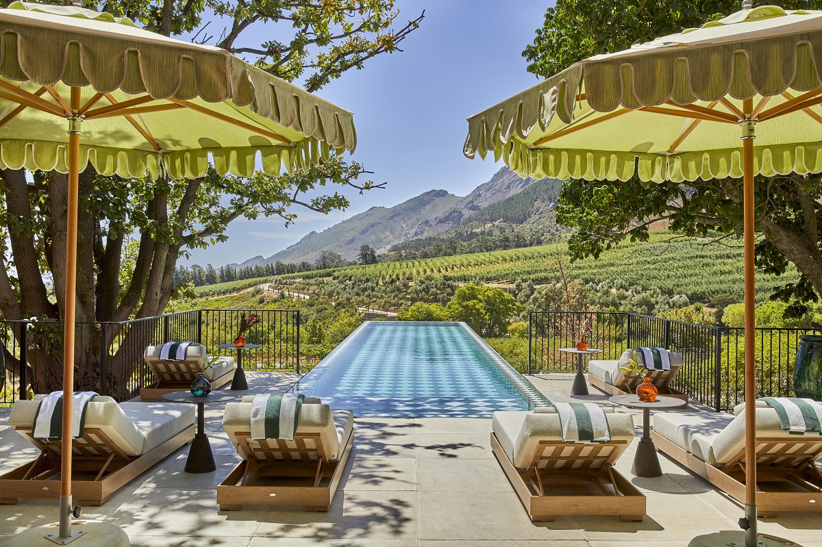 sunloungers and pool in vineyards of Franschoek House