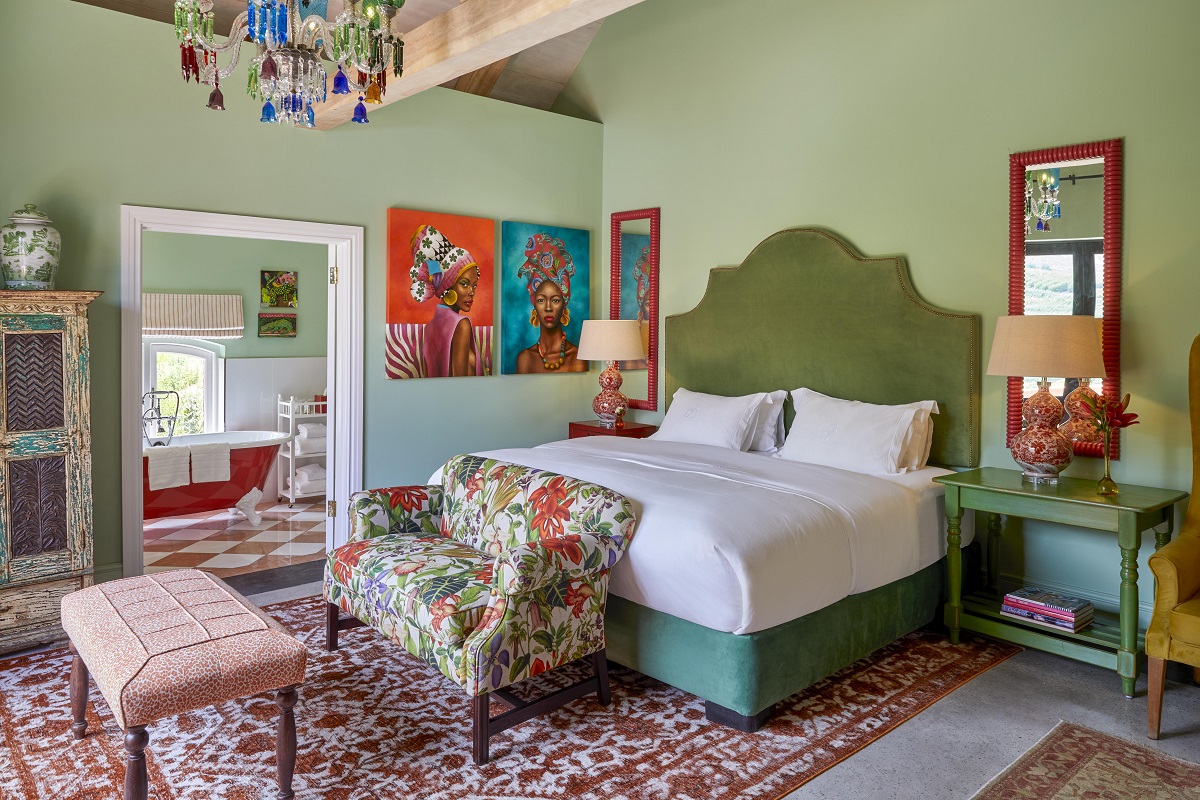 green walls and orange details in ensuite guestroom in Franschoek House