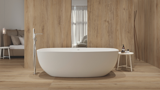 White bath tub set in wood panelled bathroom